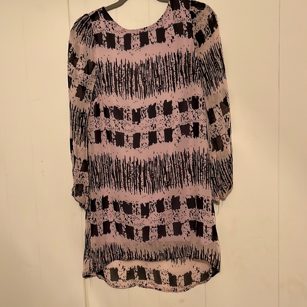 Free flowing very comfortable dress . Long sleeves are sheer .